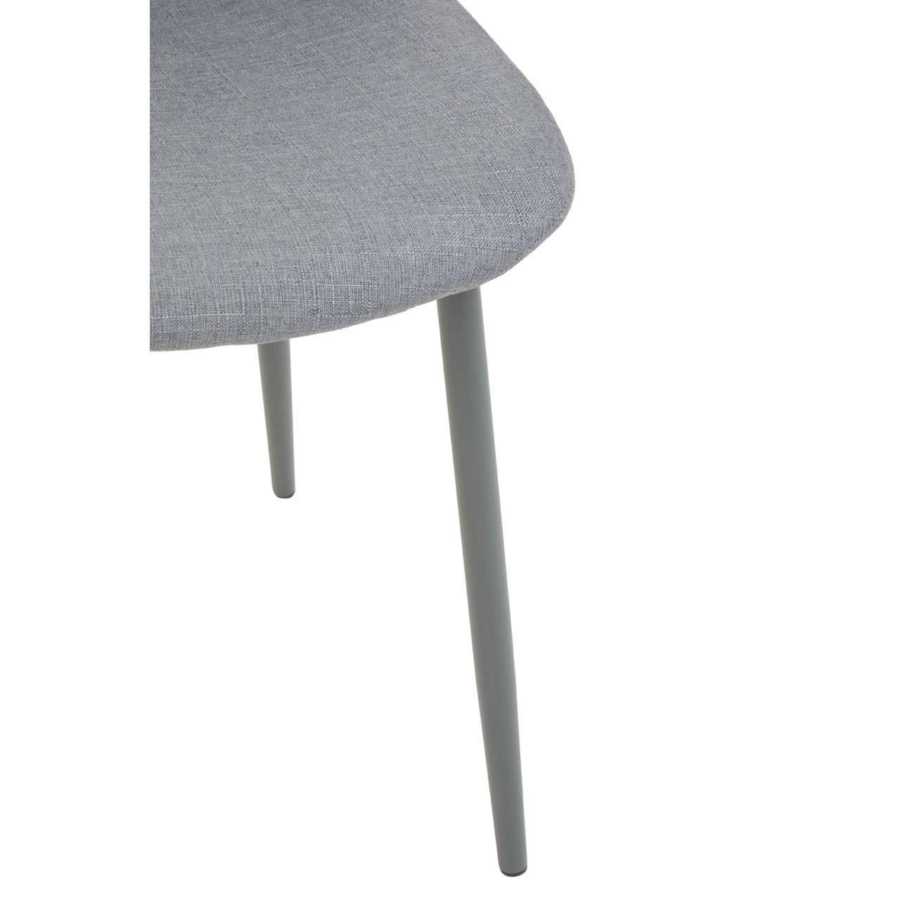 Grey fabric dining chair seat and metal legs closeup