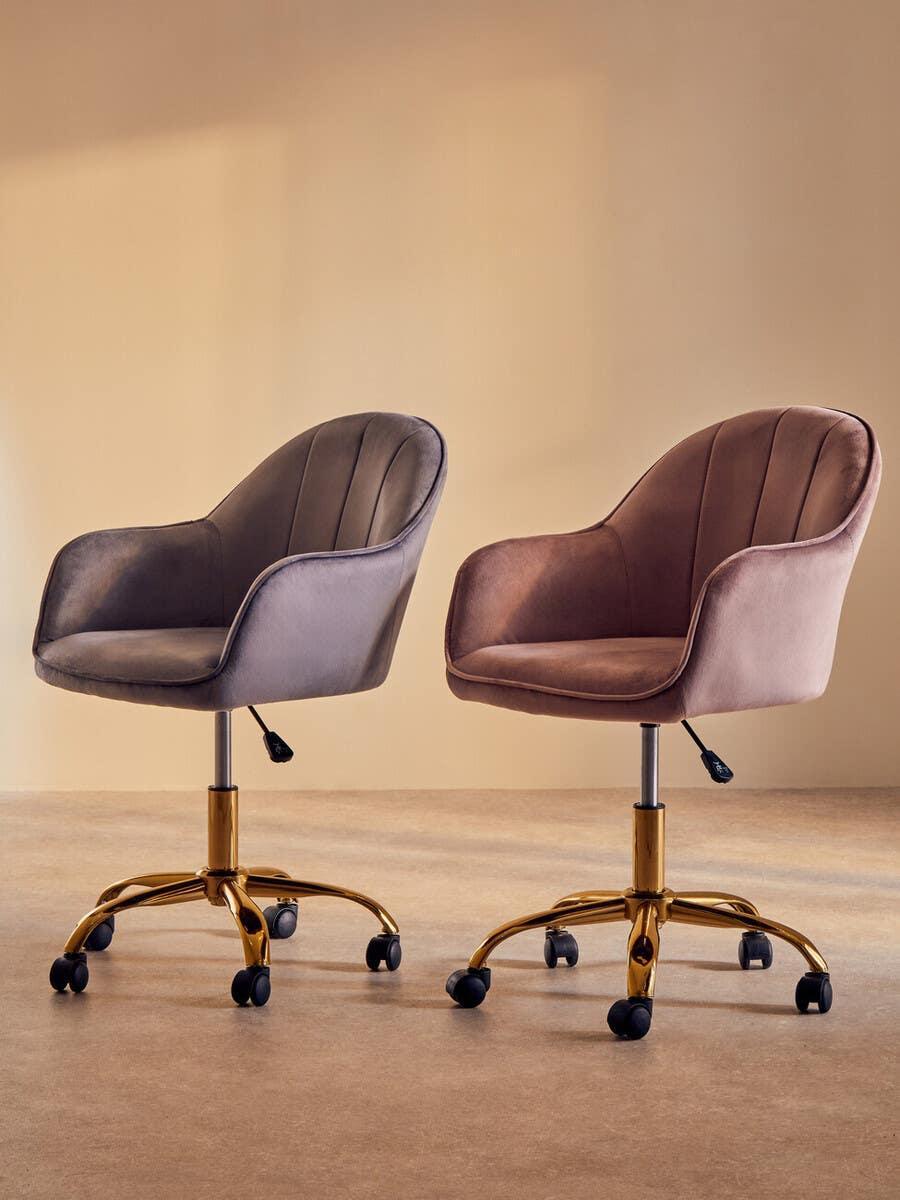 Velvet swivel office chairs in grey and blush pink with gold metal bases on castors