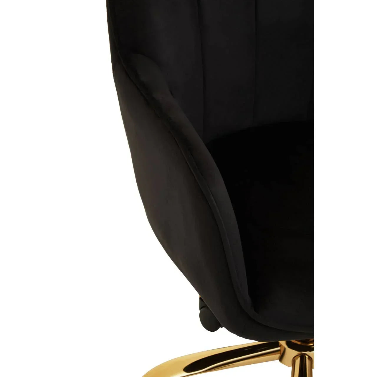 Black velvet chair with curved backrest and gold swivel base close-up