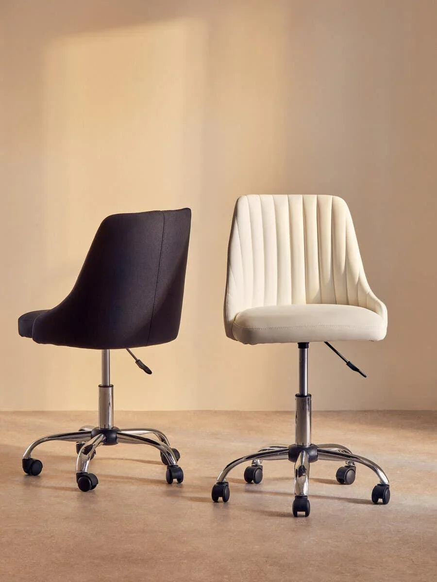 Black and cream swivel office chairs with chrome bases on castors