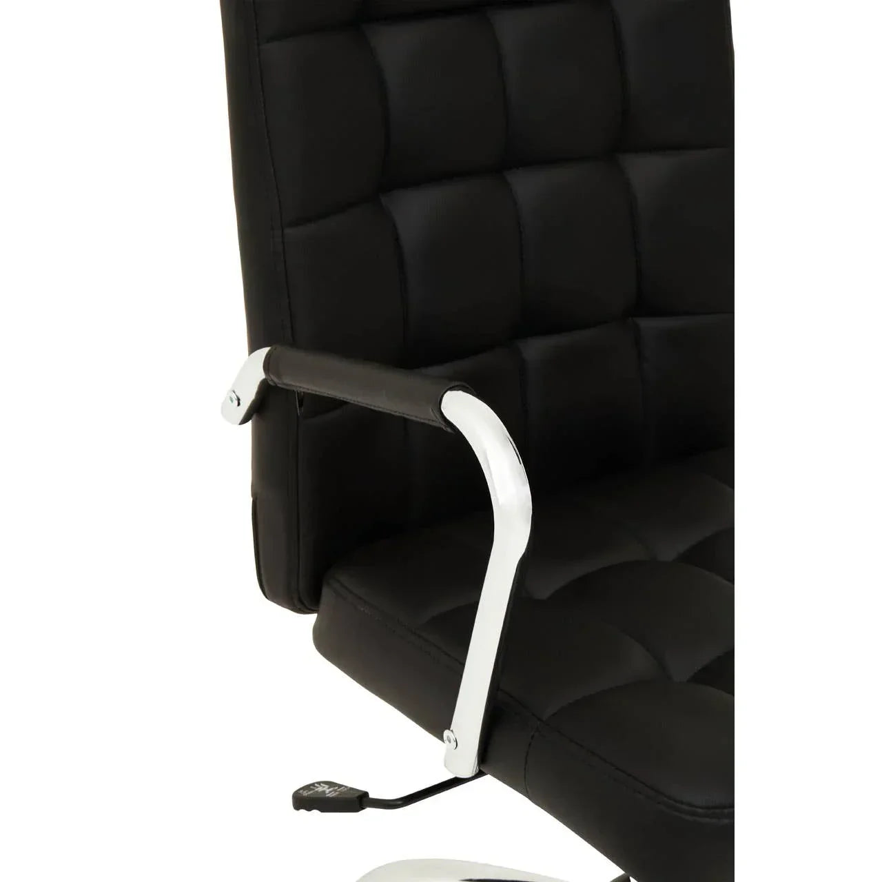 Black leather office chair with chrome armrest and quilted seat close-up