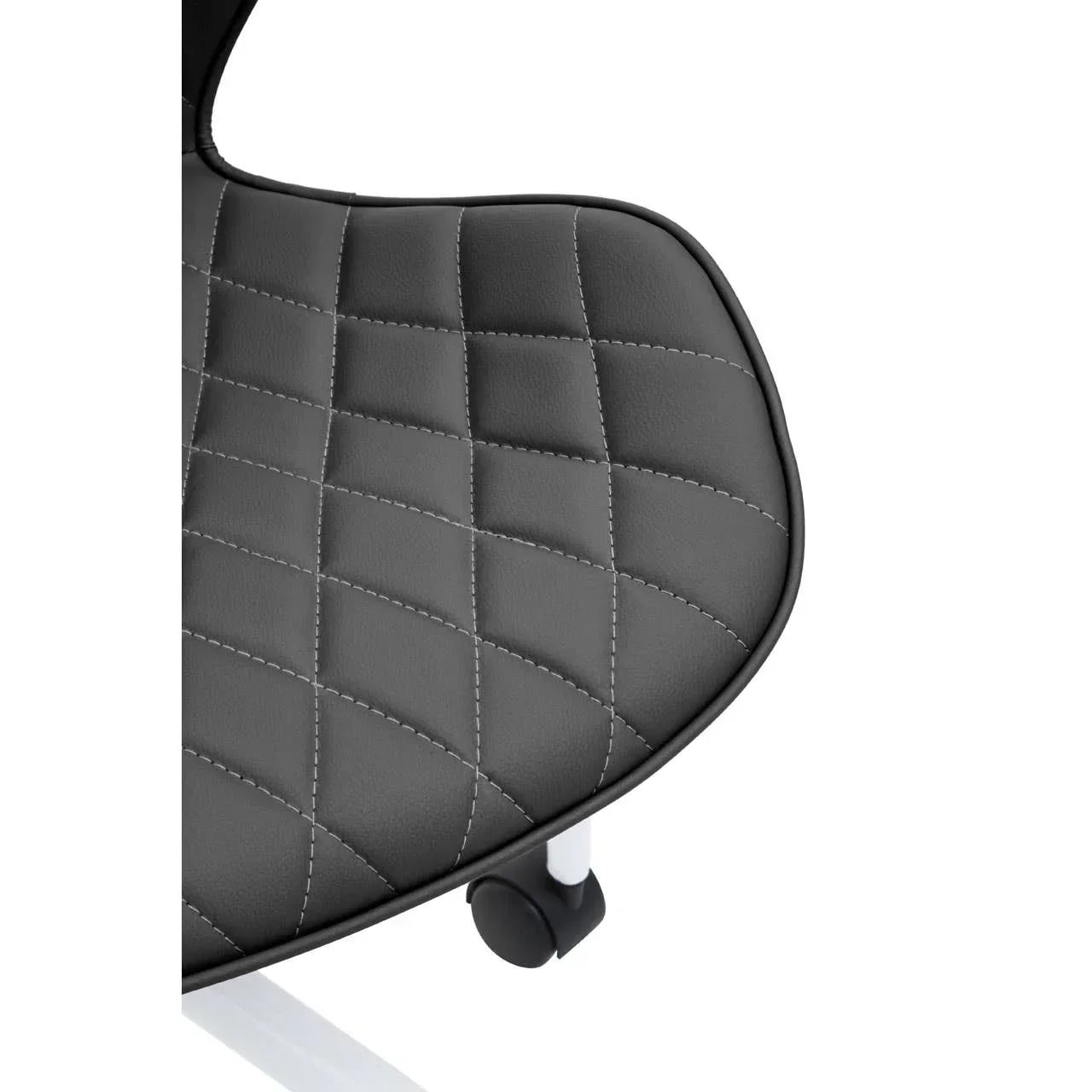Close-up of black faux leather chair seat with diamond stitching and white metal frame