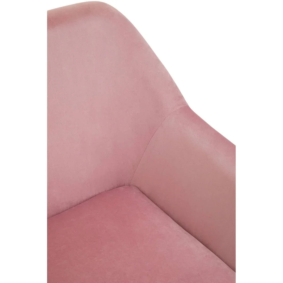 Close-up of pink velvet armchair with curved back and armrest