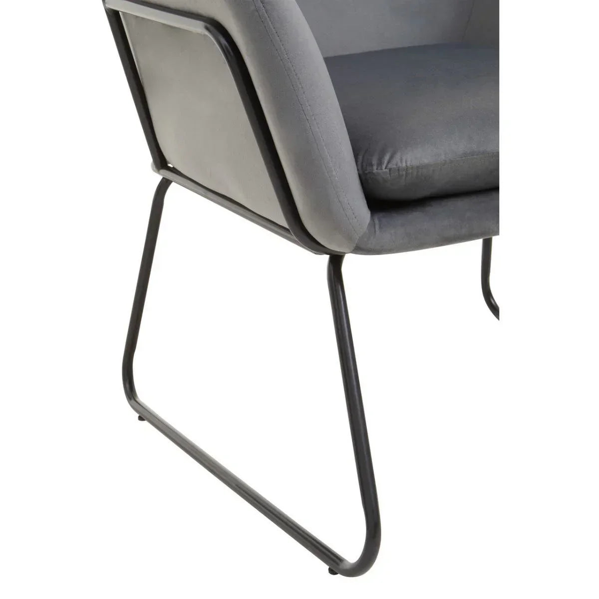 Grey dining chair with padded seat and black metal sled base, side angle view