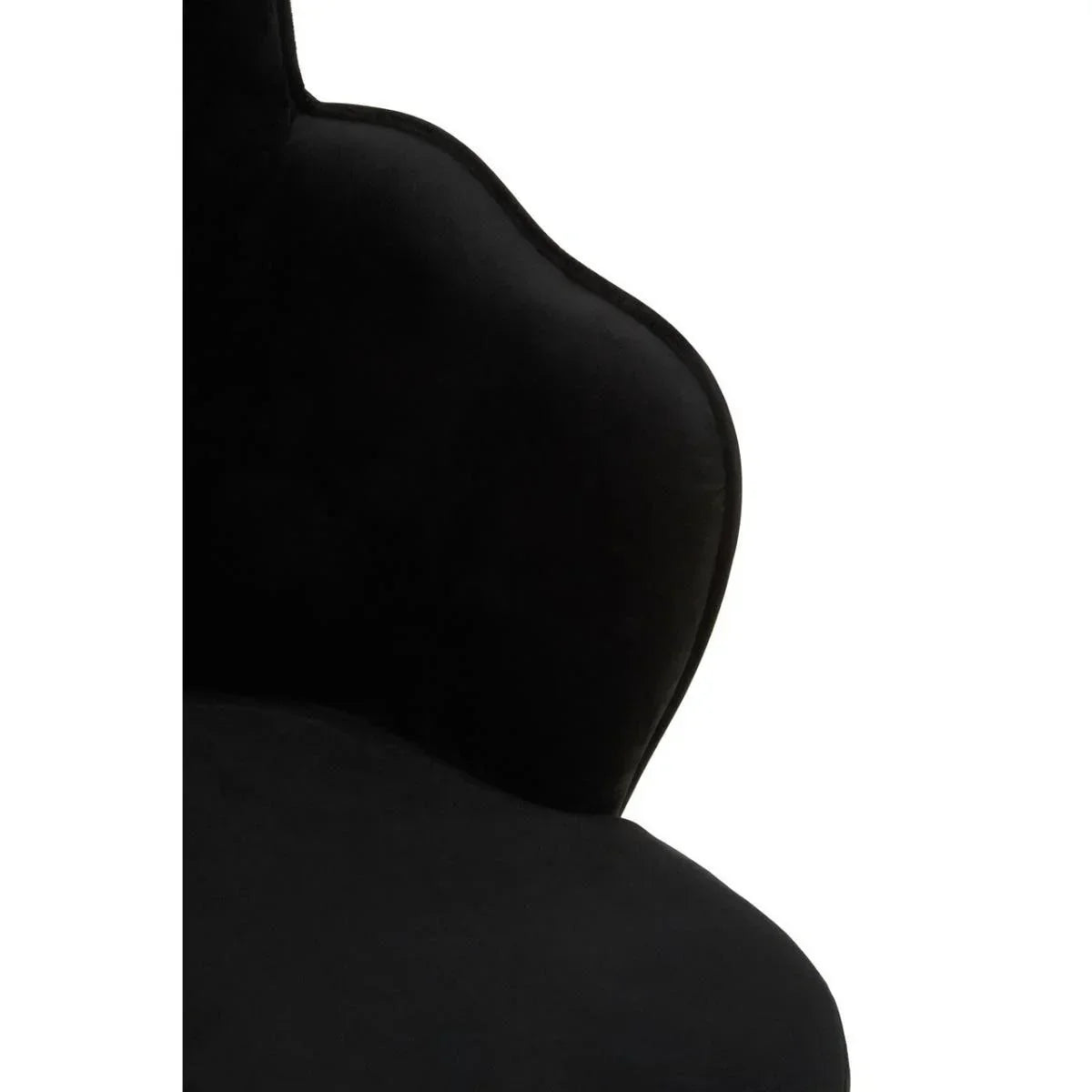 Curved black velvet chair backrest with soft upholstery, close-up detail view
