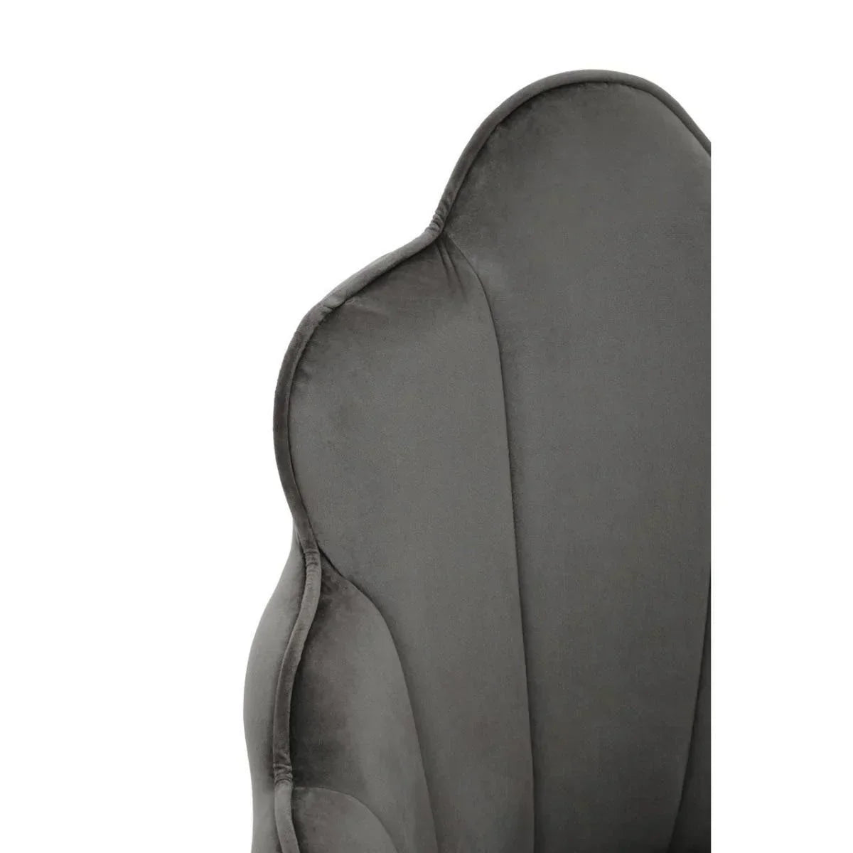 Close-up of grey velvet armchair backrest with scalloped edge detail
