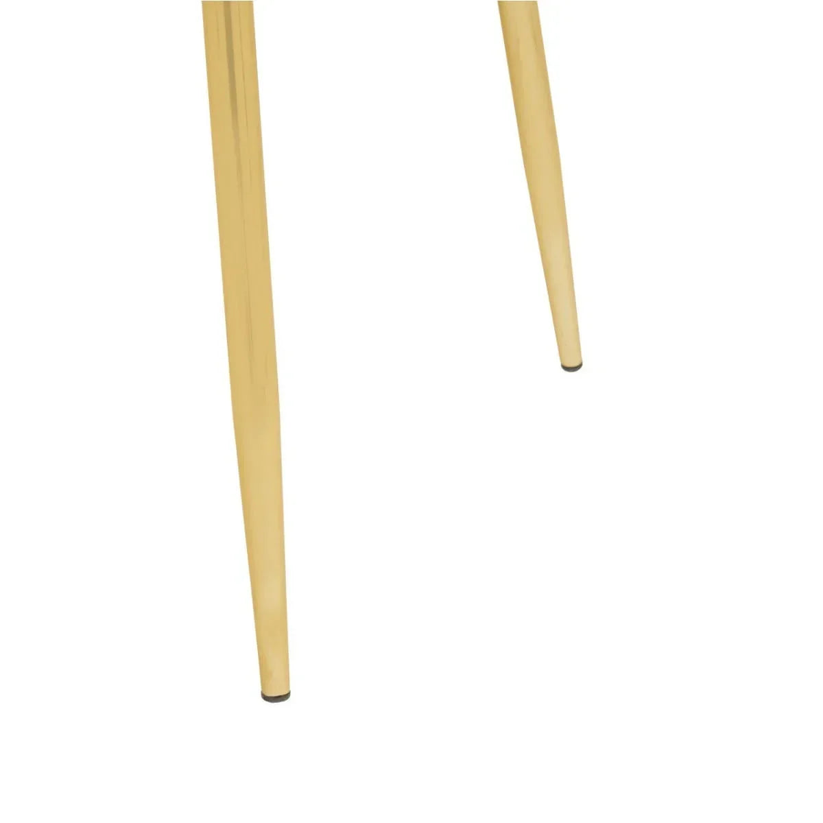 Gold metal dining chair legs with black floor protectors, close-up angle