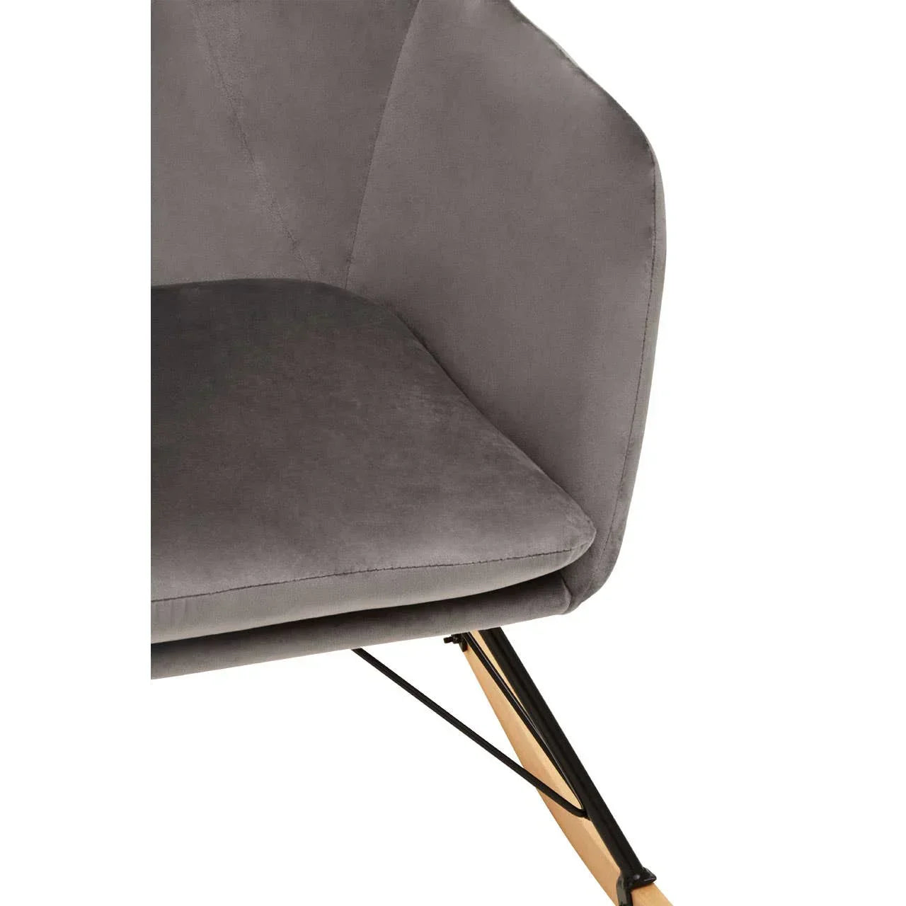Grey velvet accent chair with angled back and wooden rocking legs, close-up view