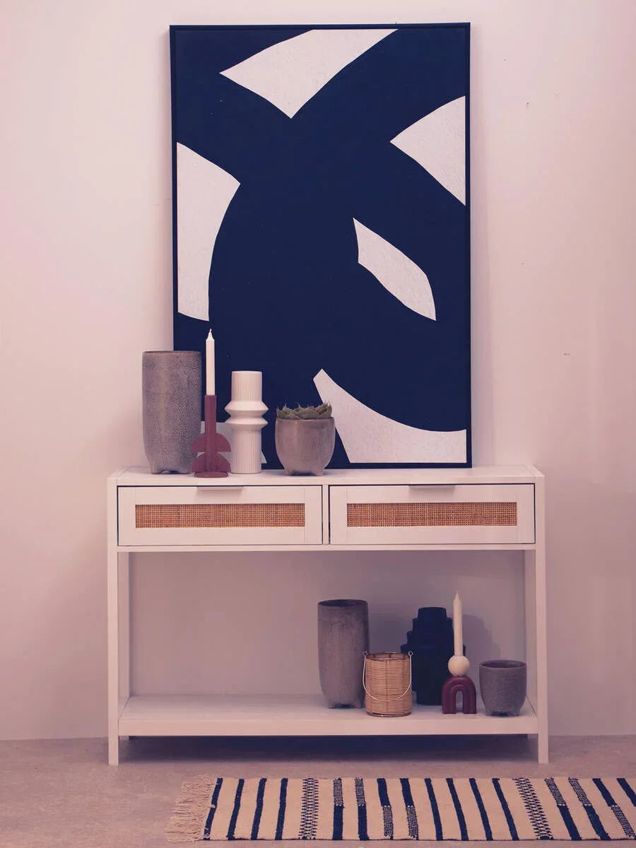 White console table with rattan drawers, modern decor and bold abstract wall art