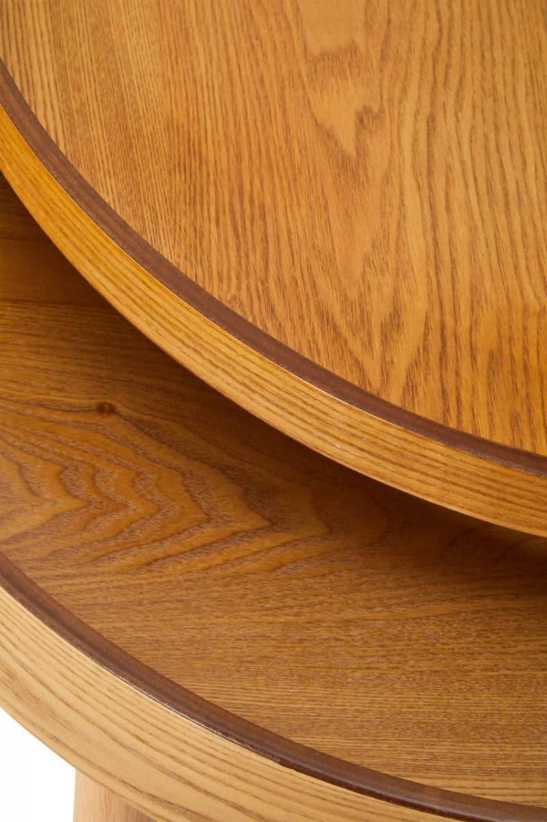 Close up of round oak side table with natural wood grain detail
