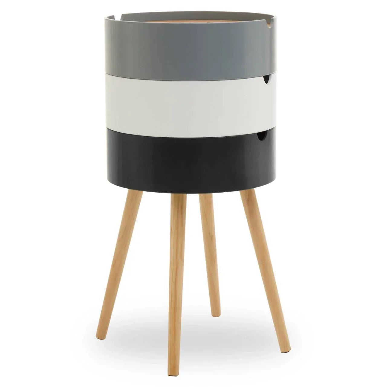 Modern bedside table with three round drawers in grey, white, and black on wooden legs