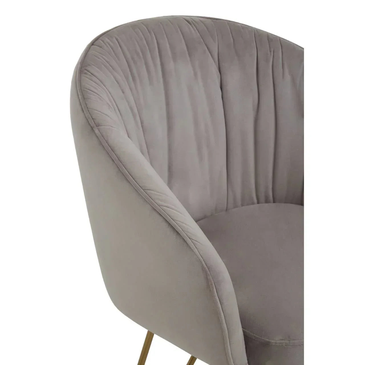 Grey velvet accent chair with curved backrest and gold metal legs, close-up view