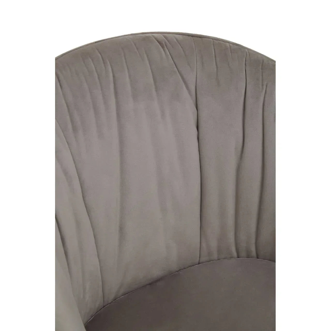 Close-up of grey velvet chair upholstery with pleated backrest detail