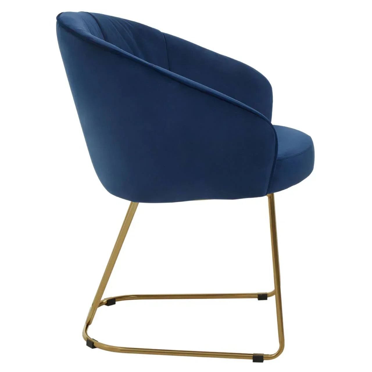 Blue velvet accent chair with curved back and gold metal sled legs, side profile view
