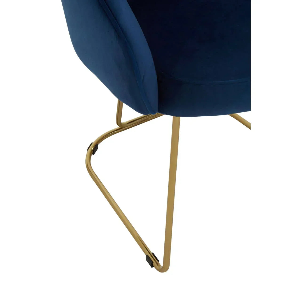 Blue velvet chair with gold metal legs, close up of curved modern frame and upholstery
