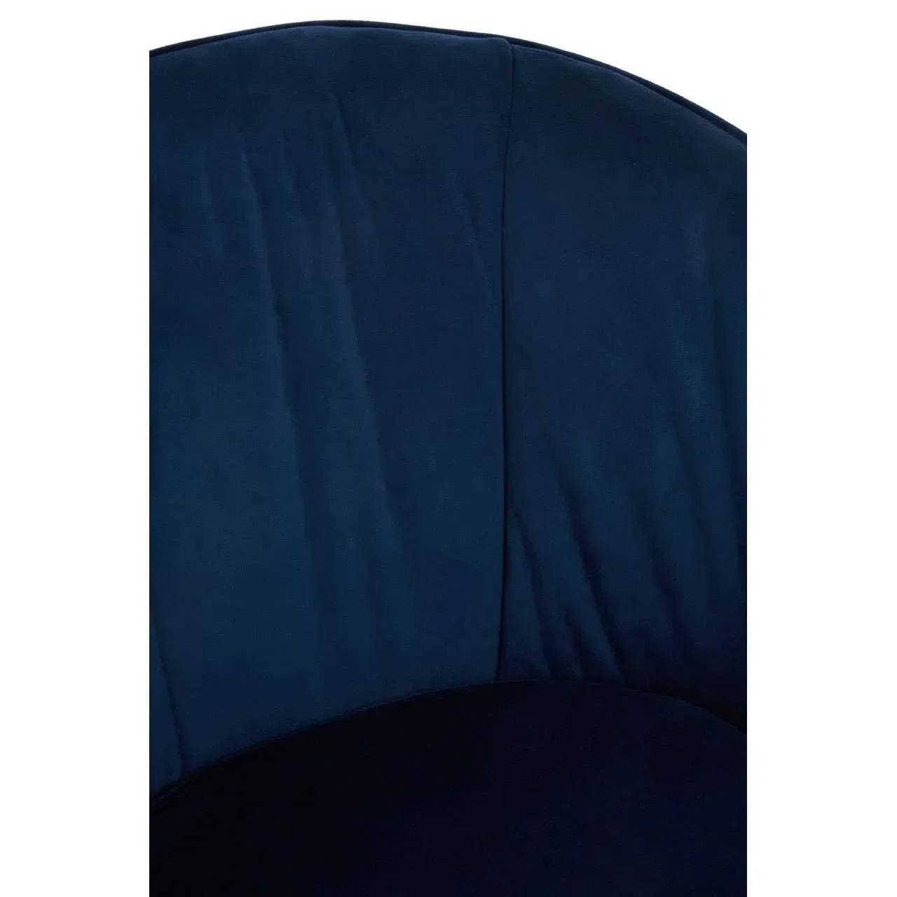 Closeup of navy velvet accent chair curved backrest upholstery