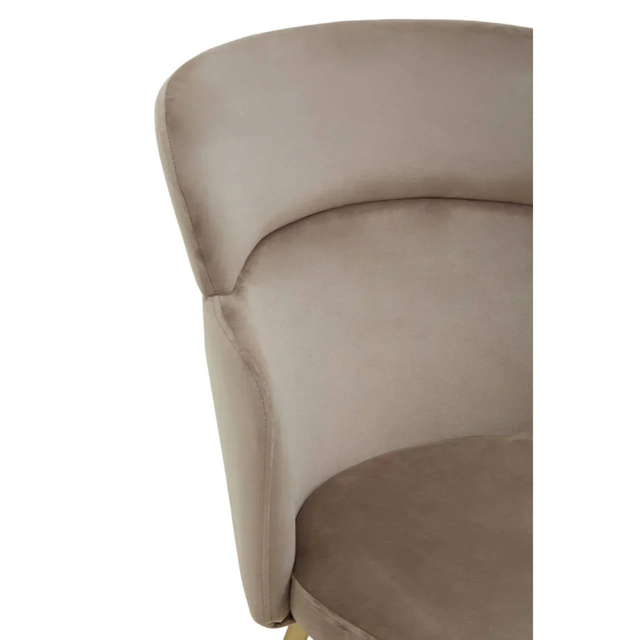 Closeup of taupe velvet accent chair with curved backrest and padded seat