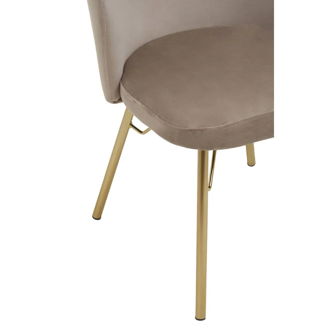 Beige velvet dining chair with gold metal legs, partial side view