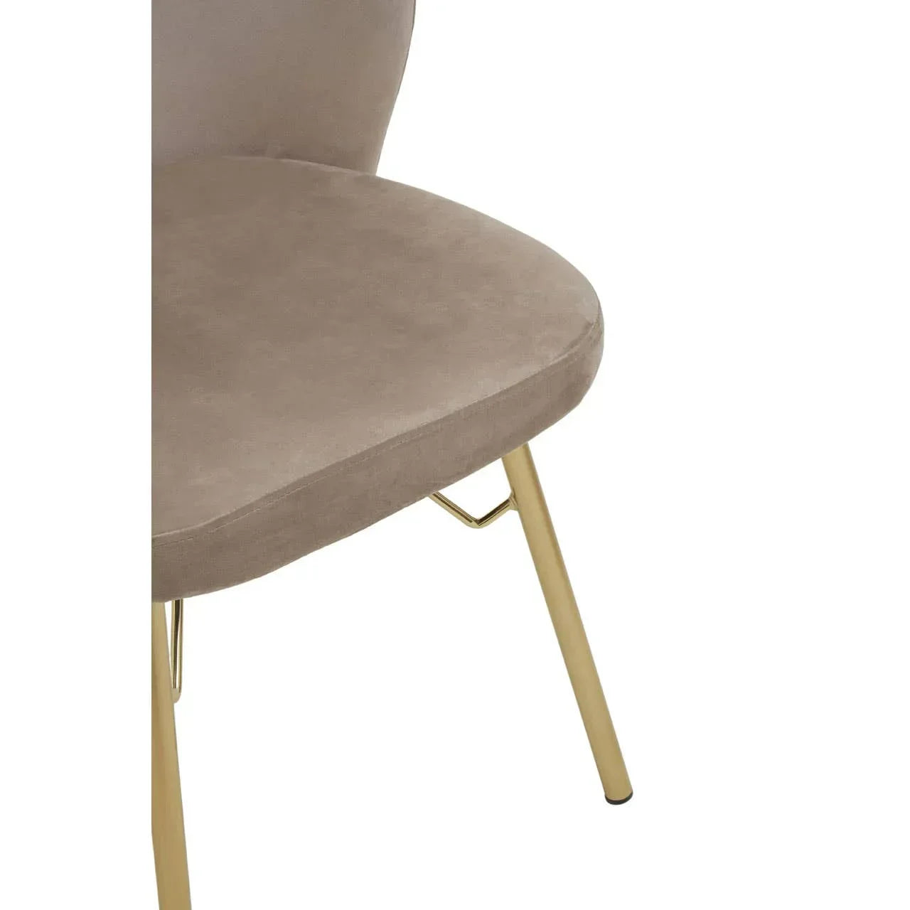Beige velvet dining chair with gold metal legs, partial side view