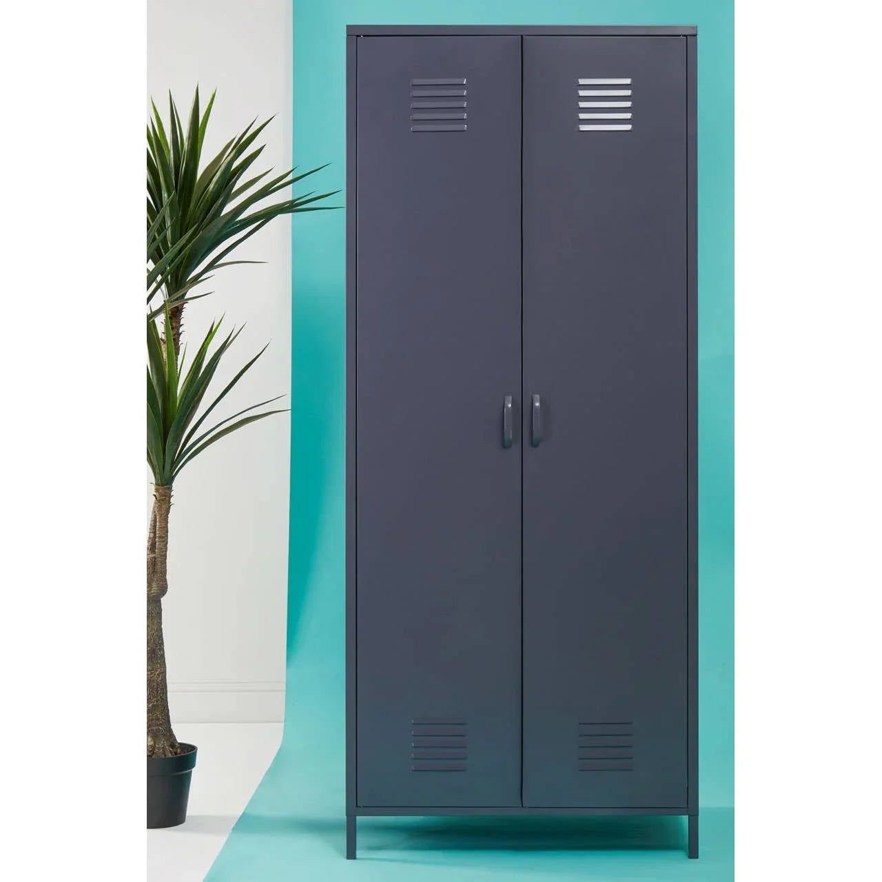 Dark grey metal storage cabinet with double doors and vented panels, styled on teal background