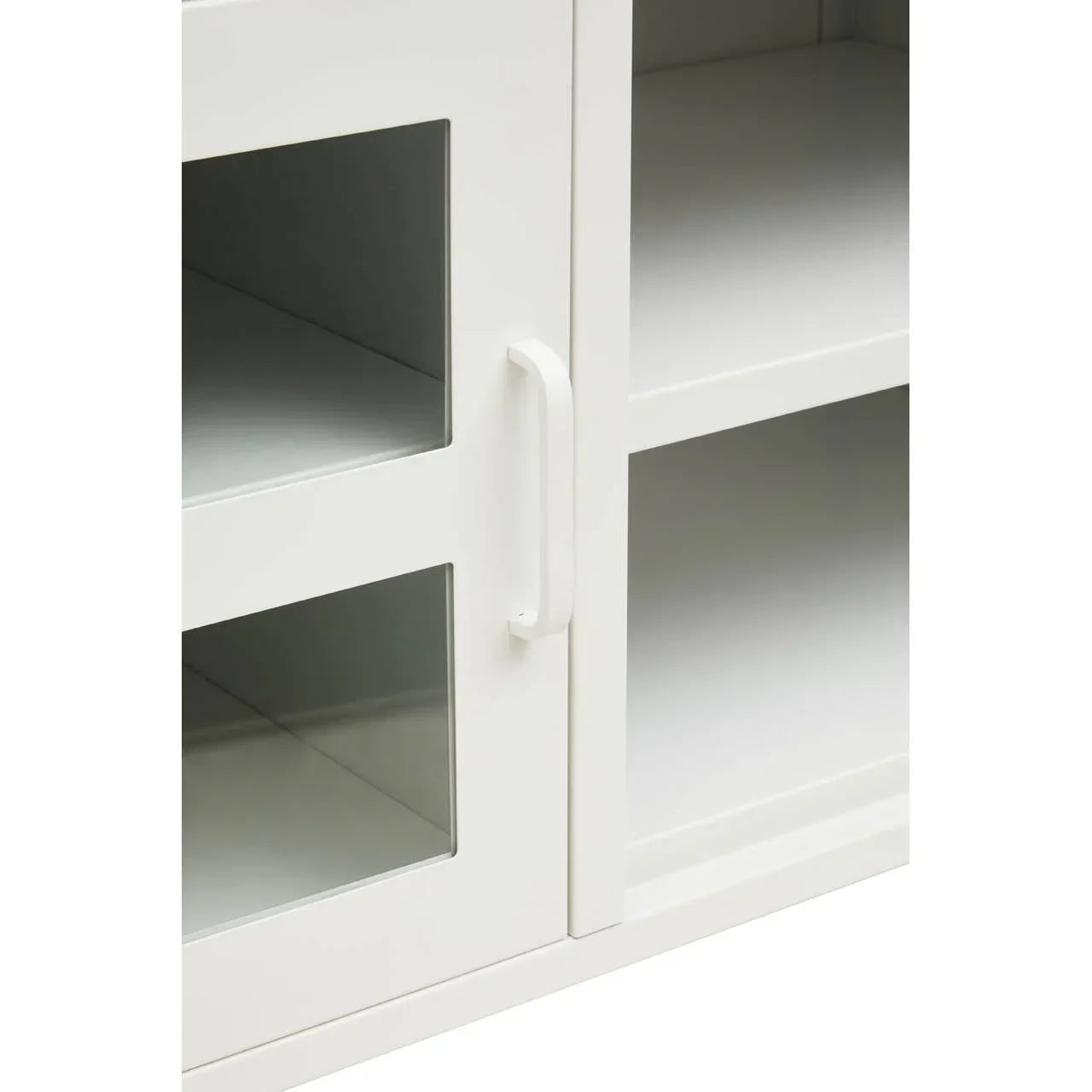 White wooden cabinet with glass panel doors and shelves, close-up of handle detail