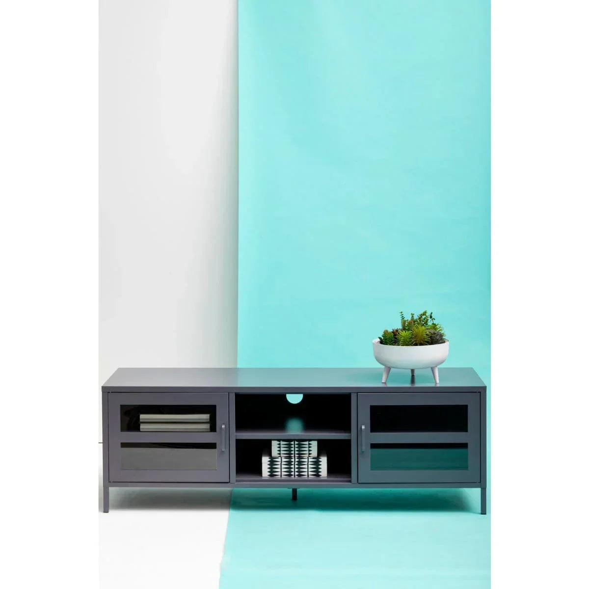 Grey TV unit with glass doors and open shelves, white planter with succulents on top