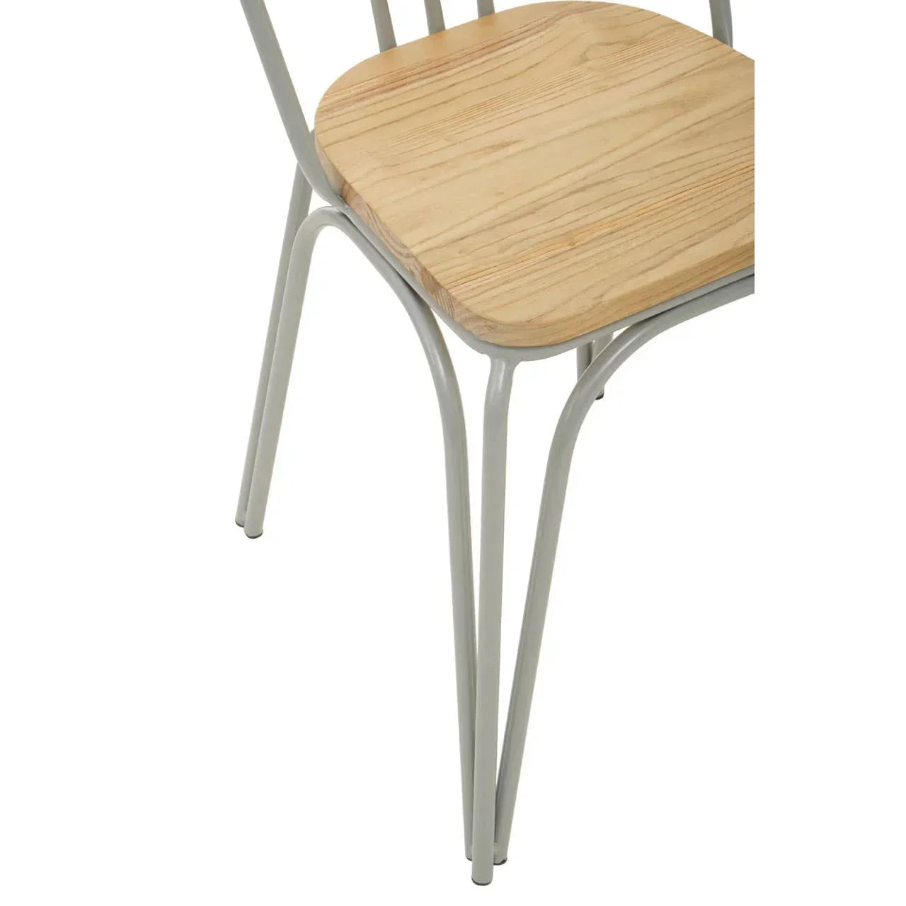 Light wood dining chair seat with grey metal legs, close-up on modern furniture design