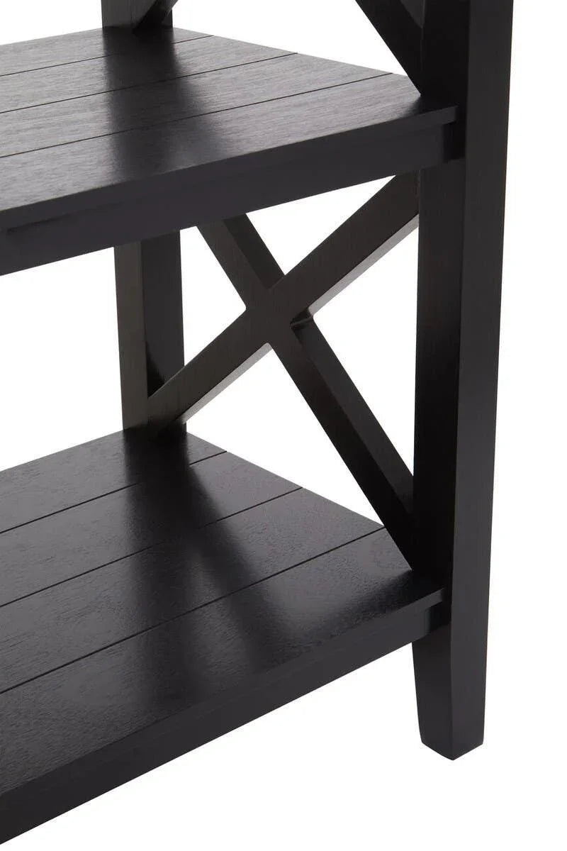 Black wooden shelving unit with X-frame side detail and slatted shelves, close-up view