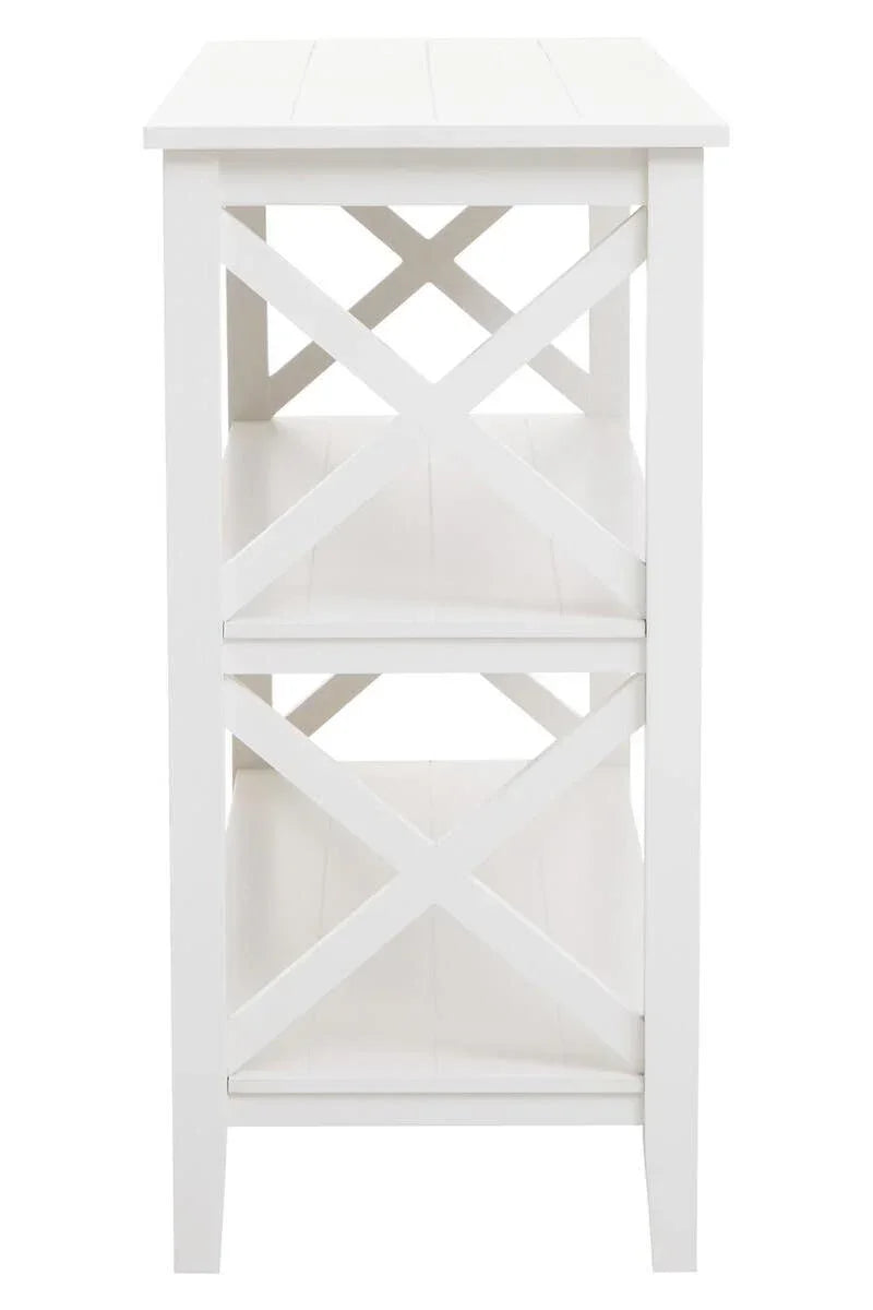 White wooden side table with two shelves and cross design sides, front angle view
