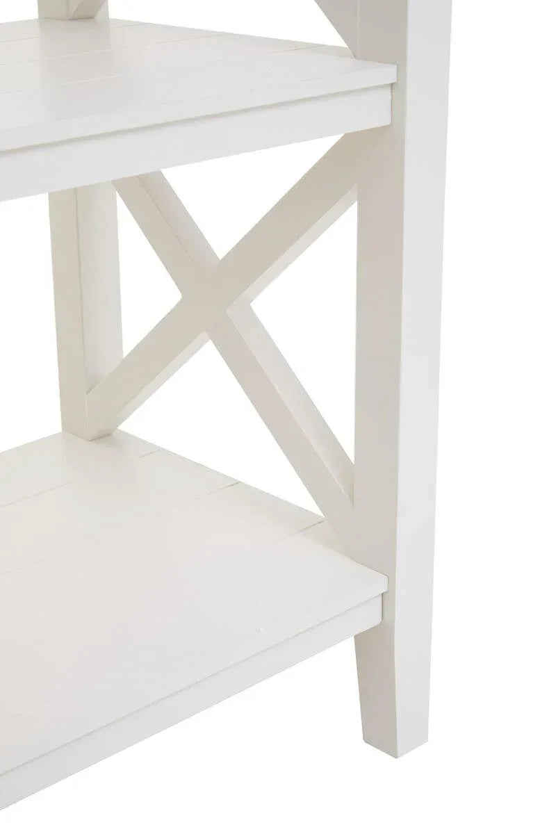 White wooden shelving unit with cross side detail and smooth finish, close-up view
