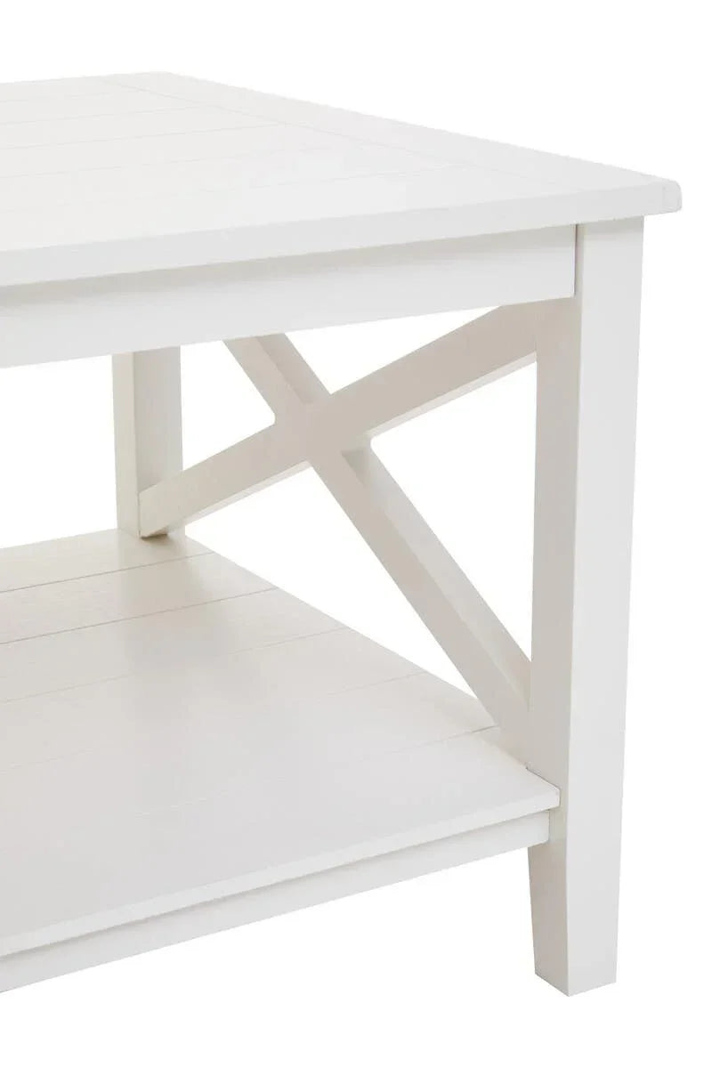 White wooden coffee table corner with cross leg and lower storage shelf
