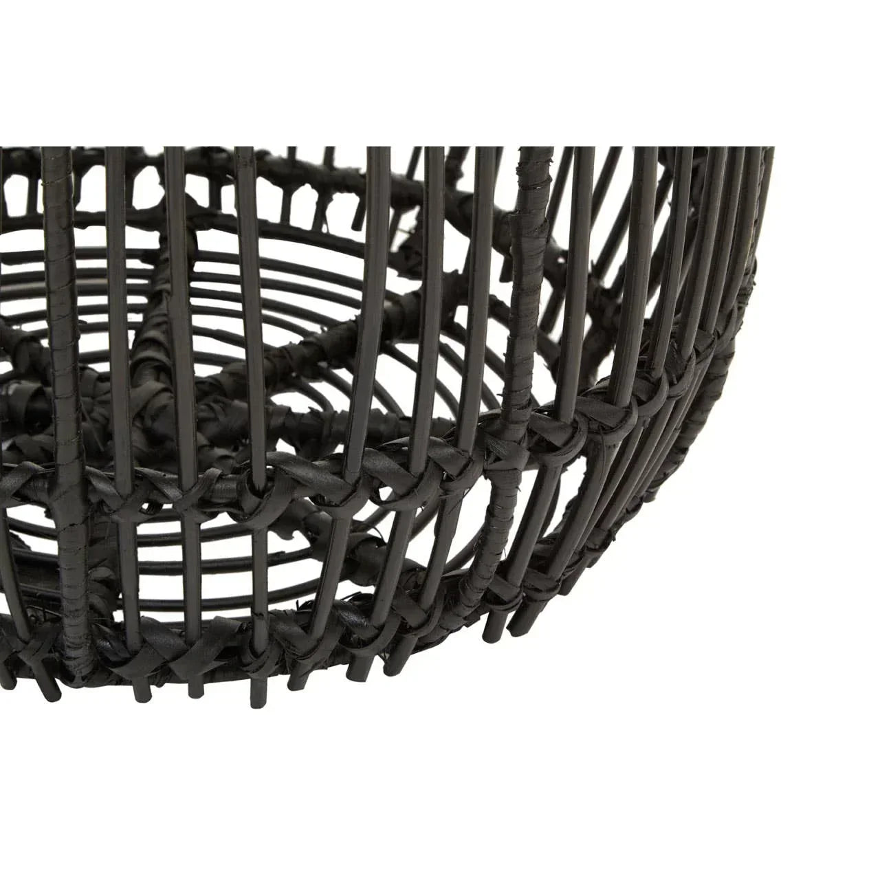 Close view of black rattan furniture weaving detail with circular base structure