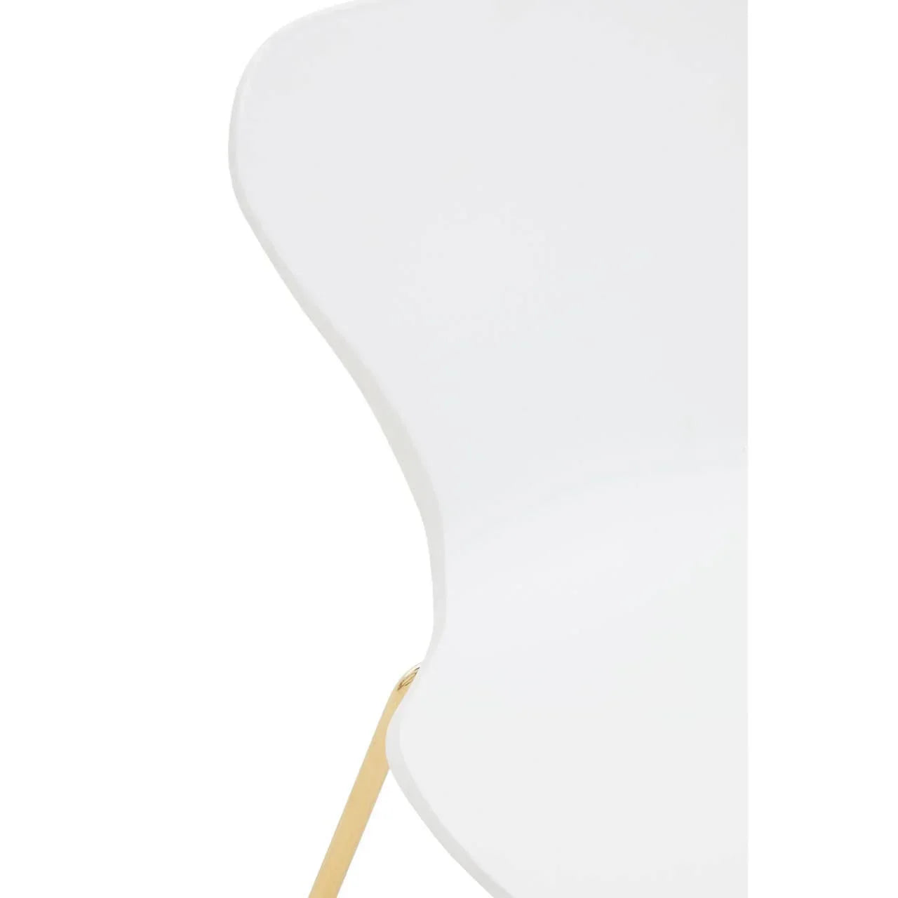 Close detail of white dining chair with gold metal leg