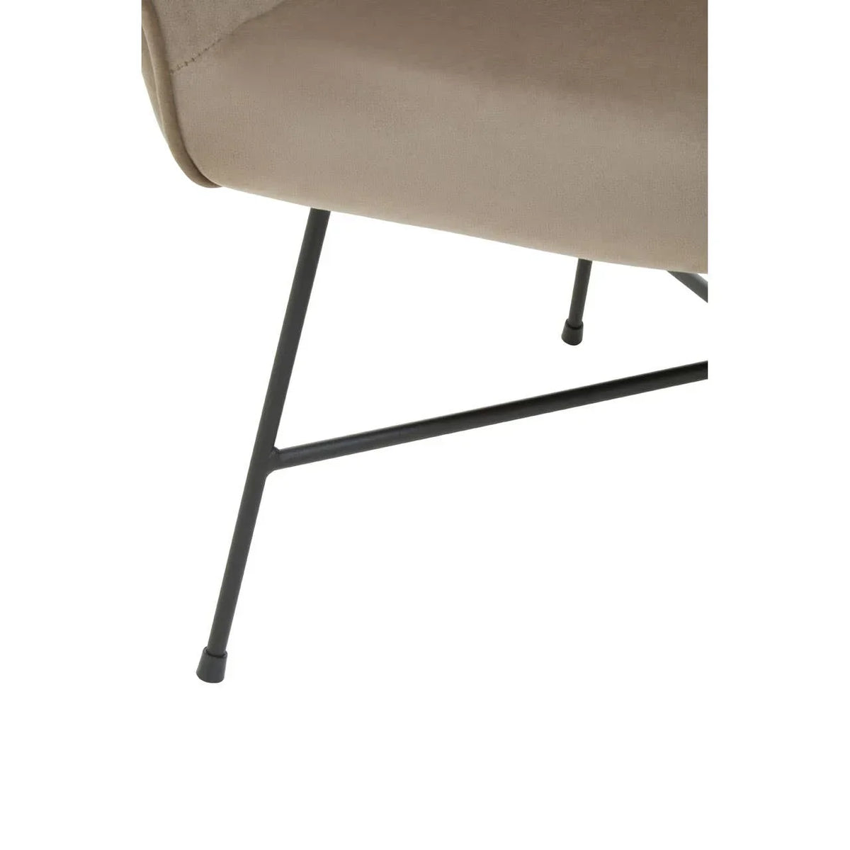 Close view of beige upholstered chair with black metal legs