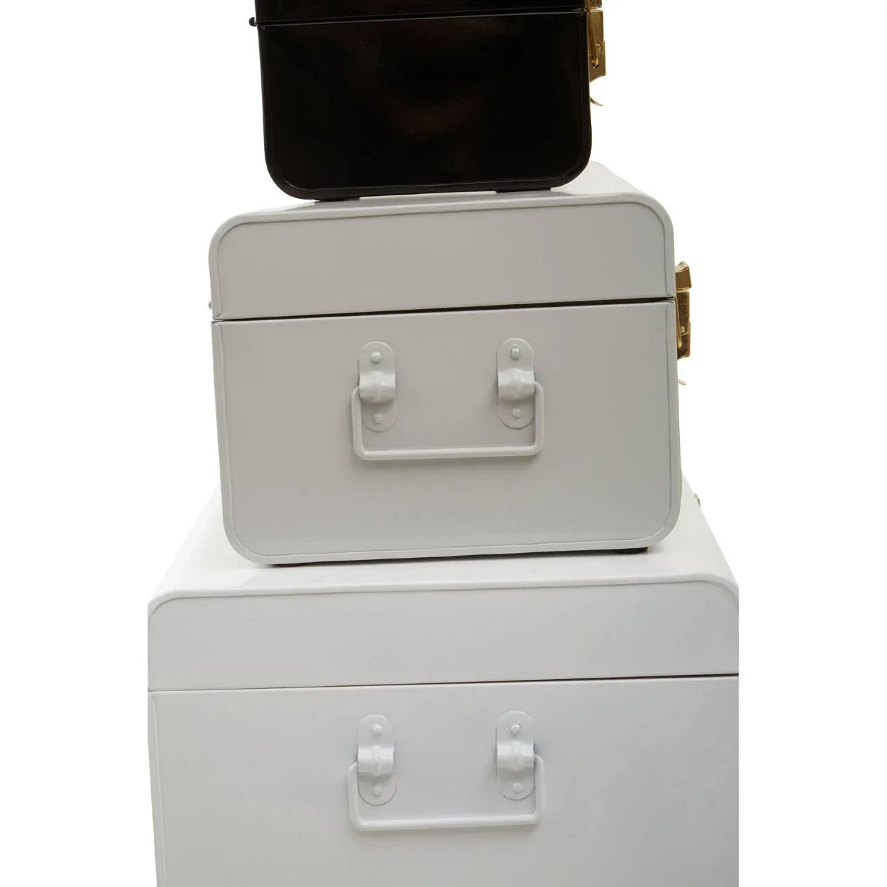 Stacked metal storage trunks in black and white with side handles and gold clasps