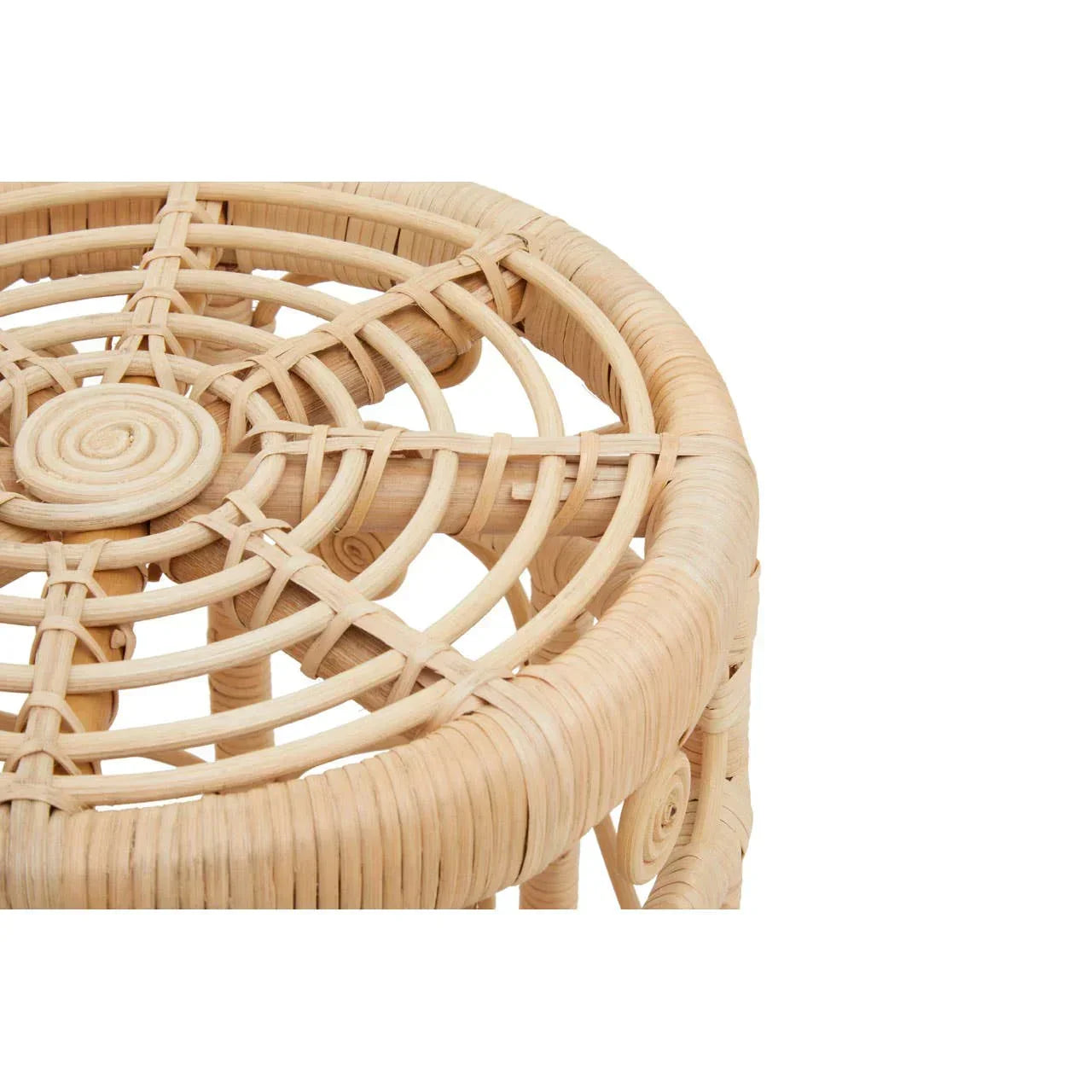 Closeup of round rattan stool top showing woven natural cane pattern