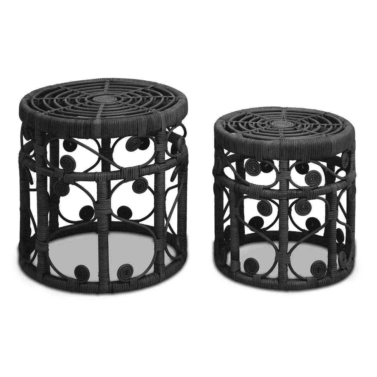 Black rattan side tables set with round tops and decorative scroll detail on white background