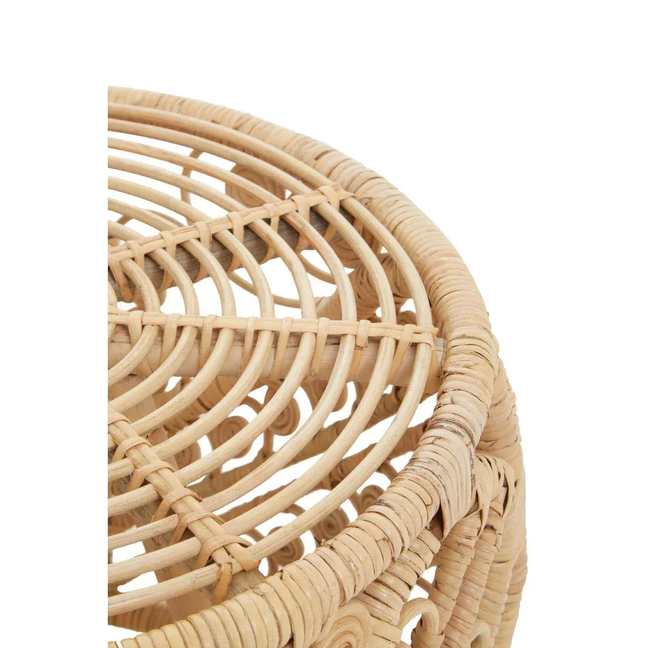 Closeup of round rattan side table with woven detail and natural finish