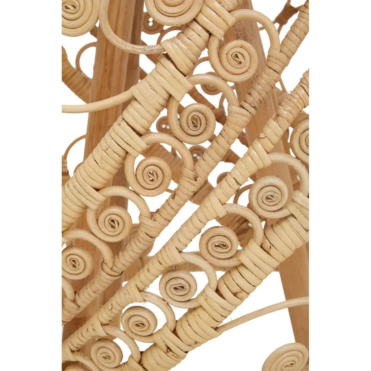 Closeup of natural rattan furniture with detailed spiral weaving pattern