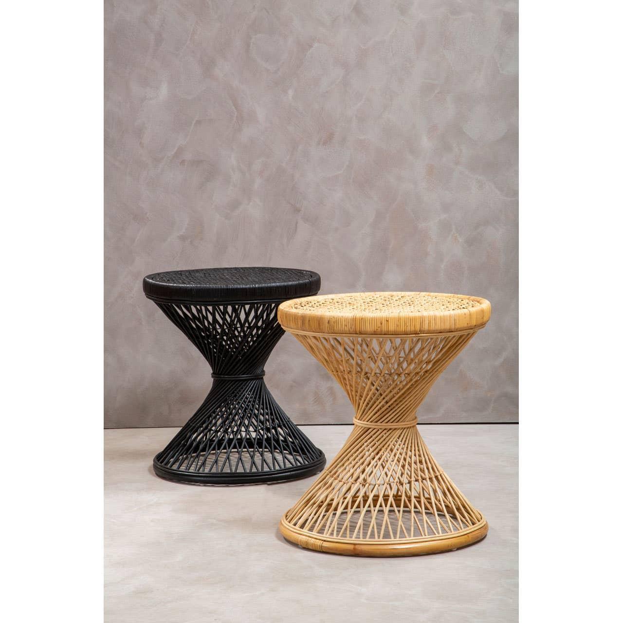 Round rattan side tables in black and natural finish on neutral background
