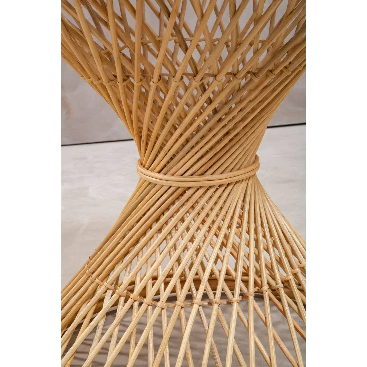 Close view of natural rattan furniture base with intricate woven pattern