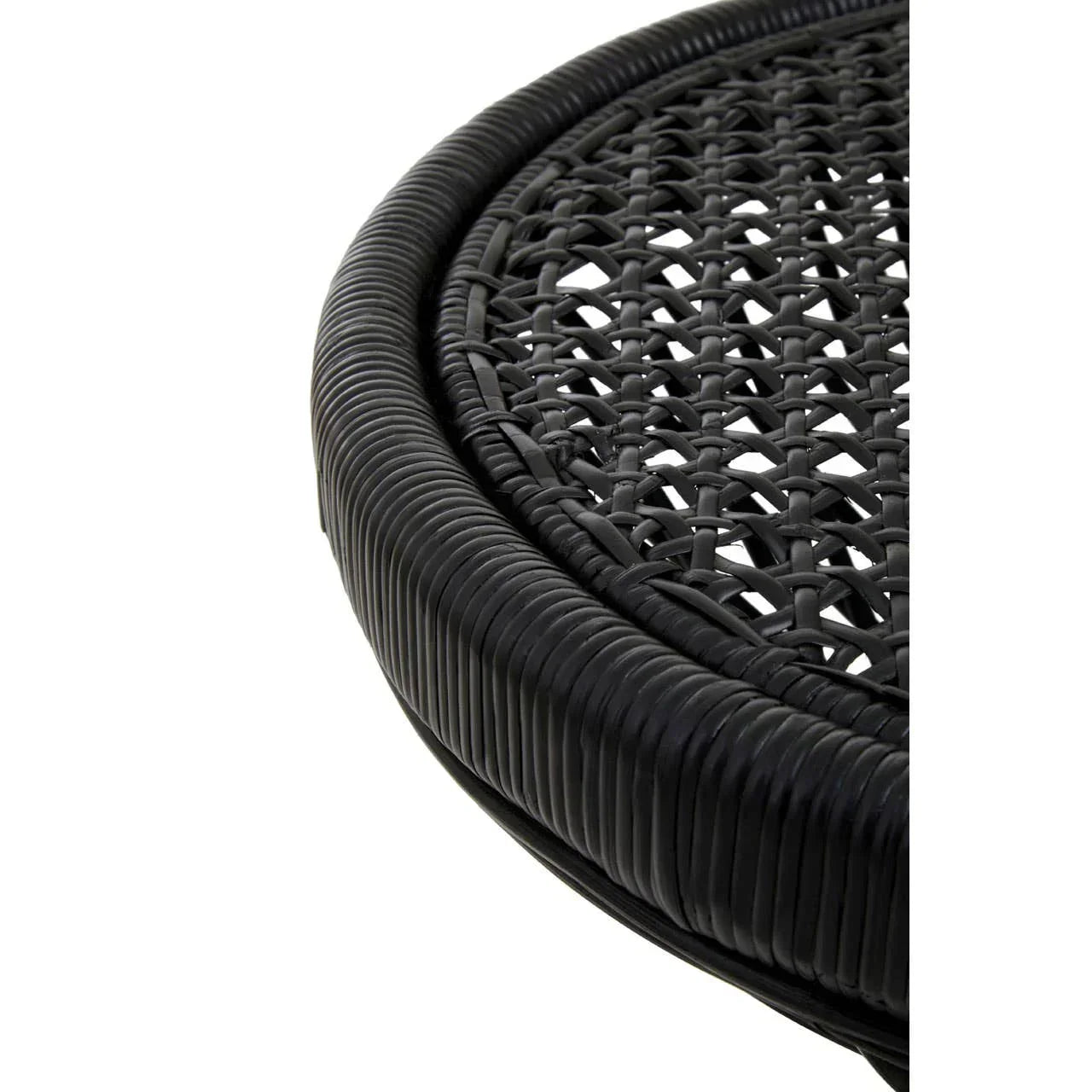 Closeup of black rattan garden table edge and woven tabletop detail