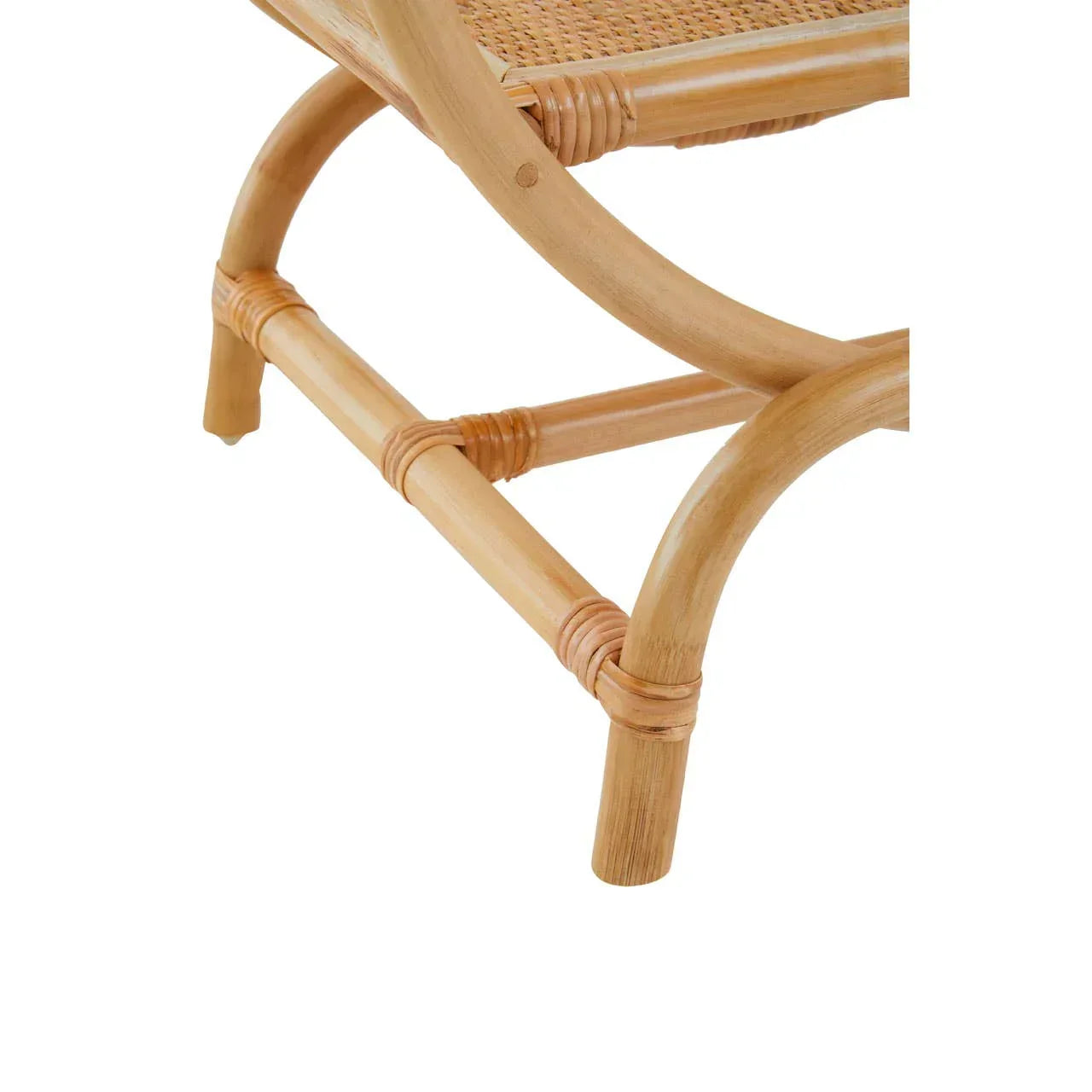 Closeup of rattan chair legs and woven cane seat detail