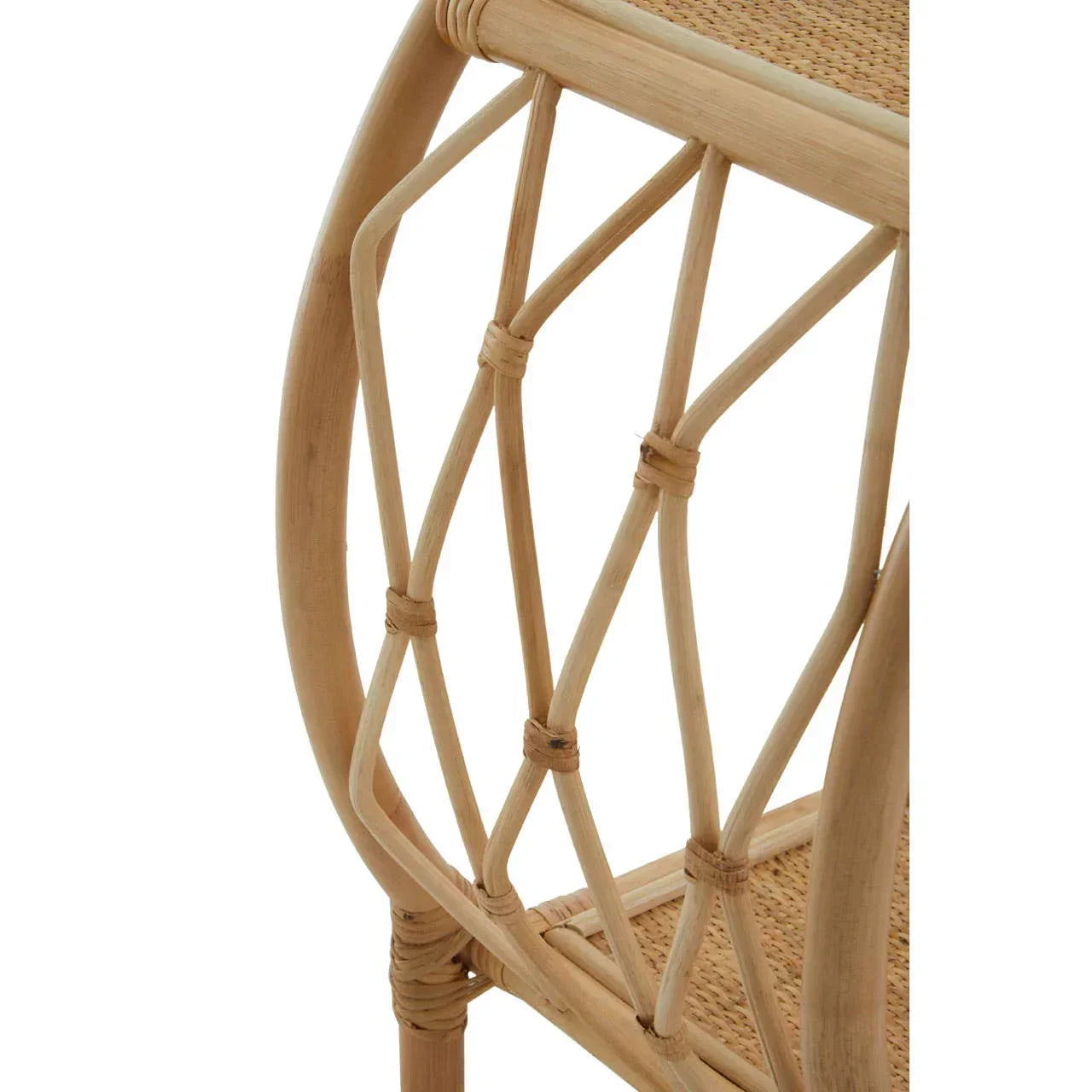 Close-up of rattan furniture side detail with woven shelf and curved wooden frame