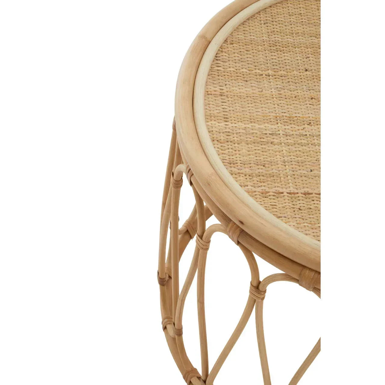 Round rattan side table with woven cane top and open weave base, close-up view