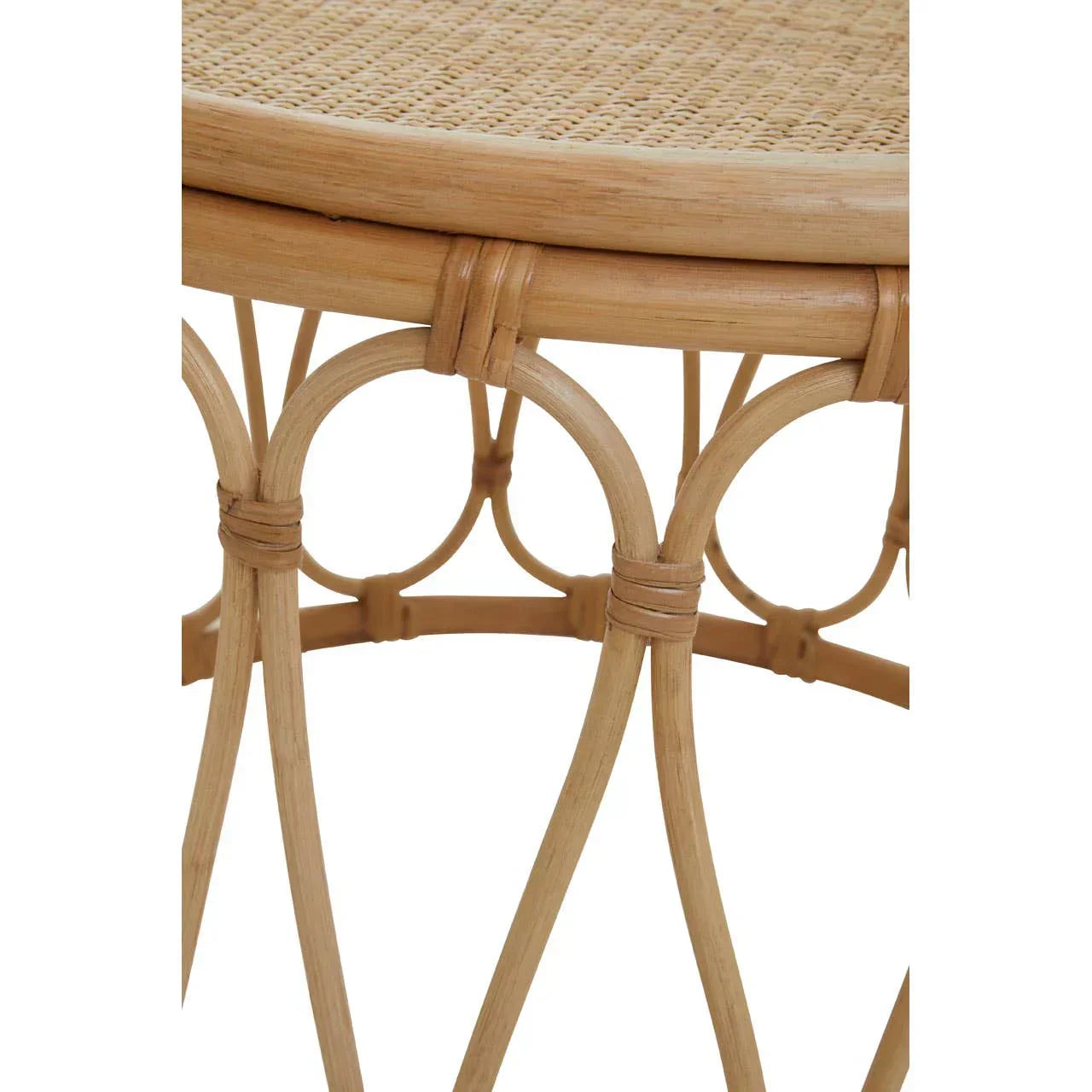 Close view of round rattan table with woven top and decorative bentwood legs