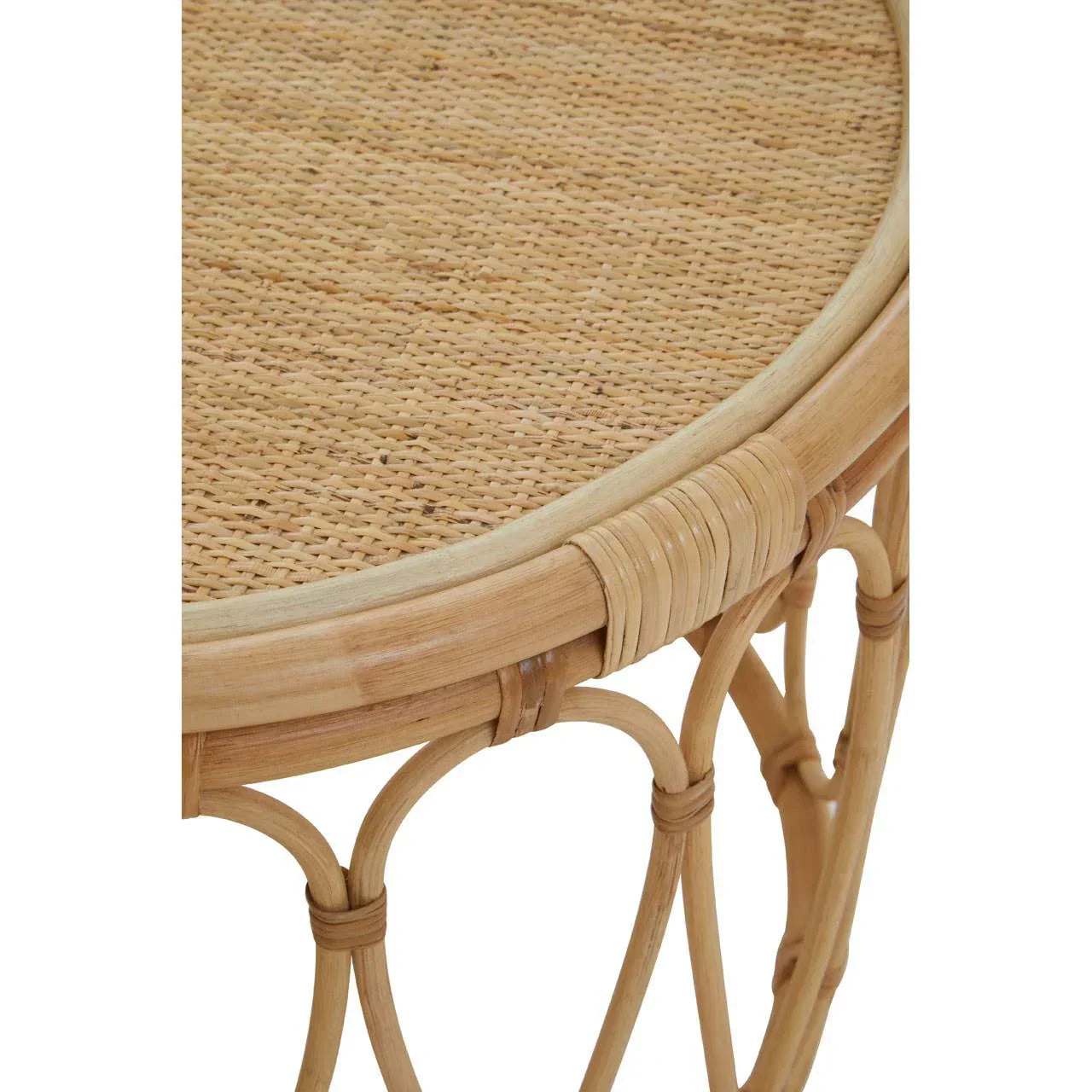 Round rattan side table with woven top and curved natural wood legs, close-up view
