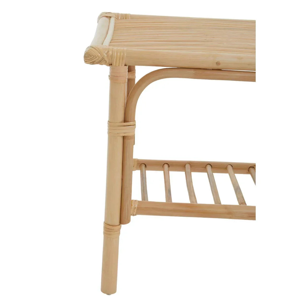 Closeup of rattan side table with slatted lower shelf and natural wood finish