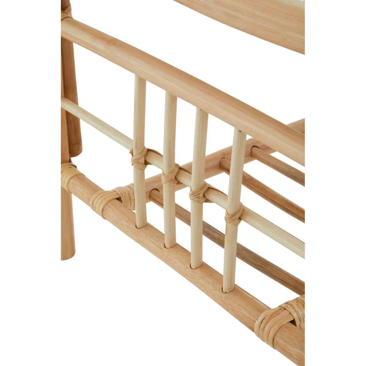 Close-up of rattan furniture frame with natural woven details and smooth bamboo finish