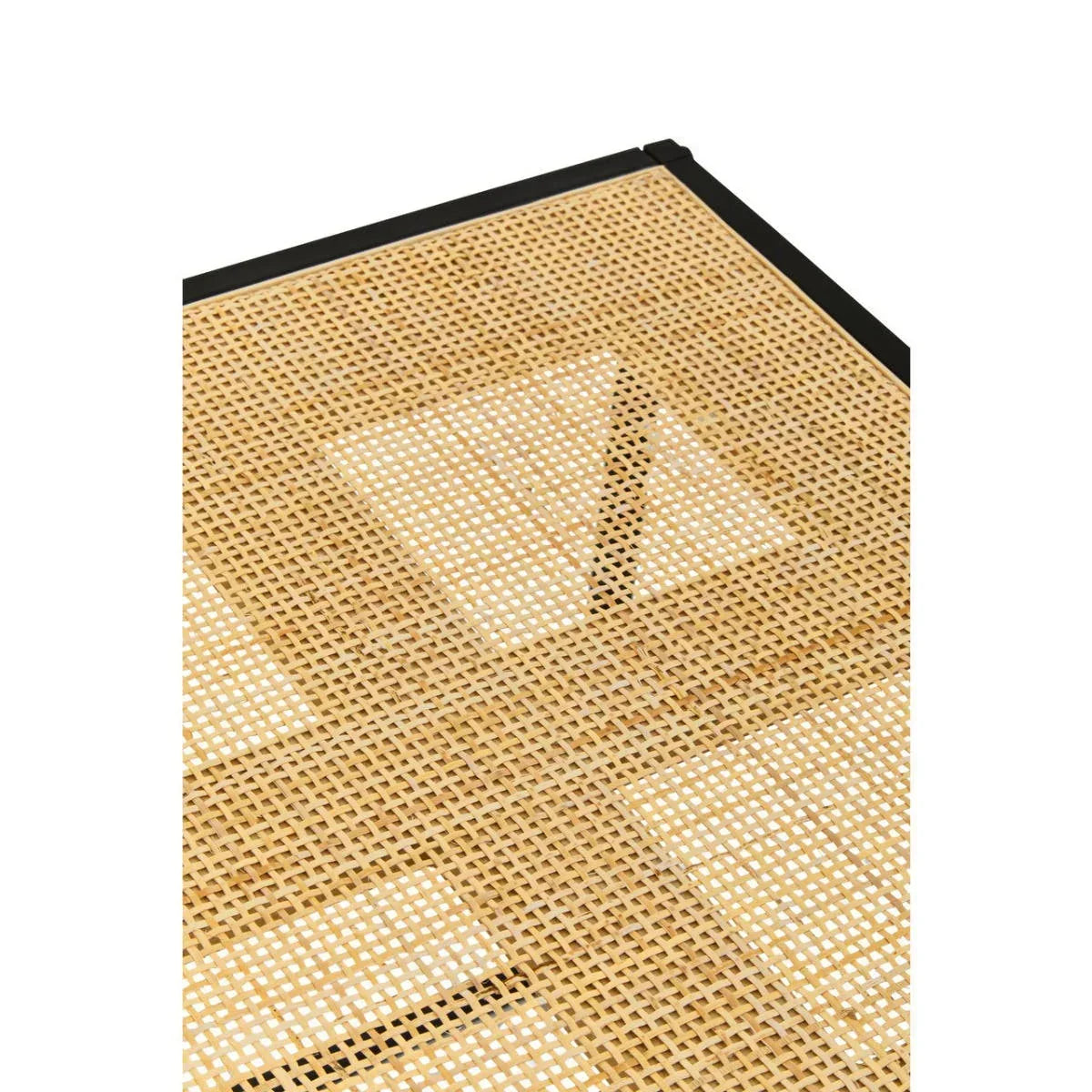 Closeup of woven rattan tabletop with black metal frame corner
